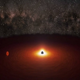 La NASA capta una enorme llamarada causada por la 'danza' de dos agujeros negros